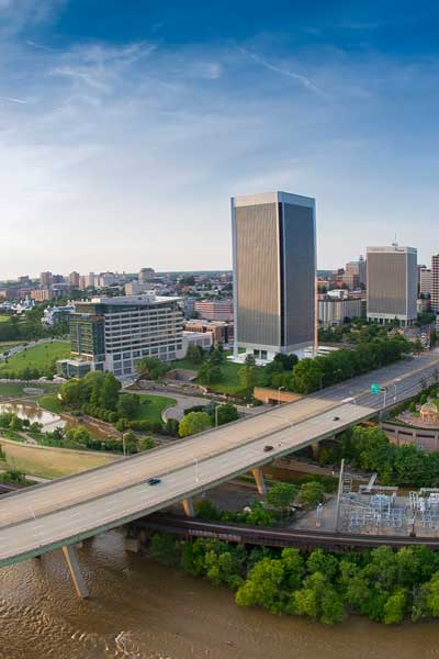 aerial view of the james river, a bridge, and downtown richmond virginia